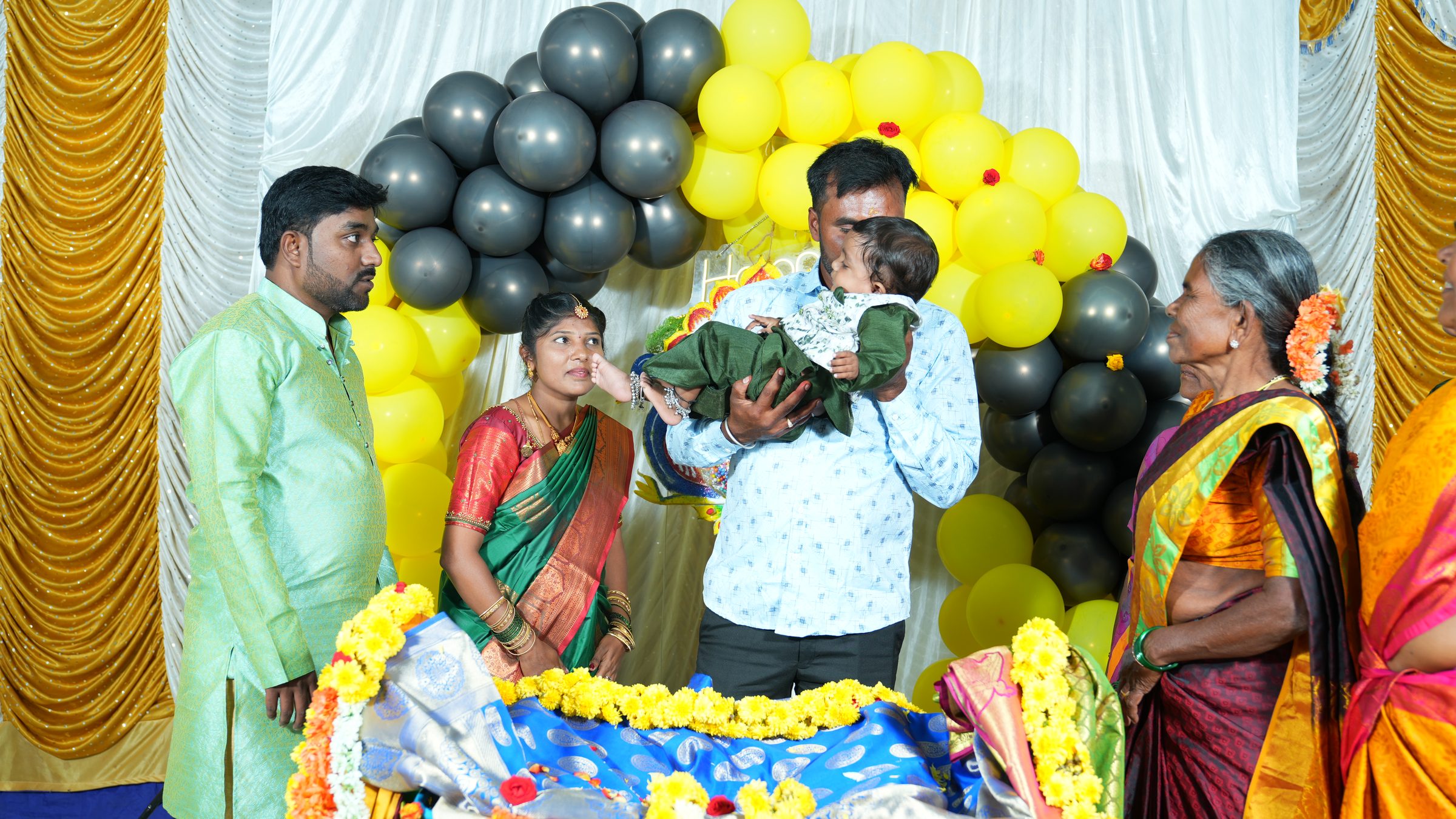 Family during a naming ceremony celebration in Bangalore