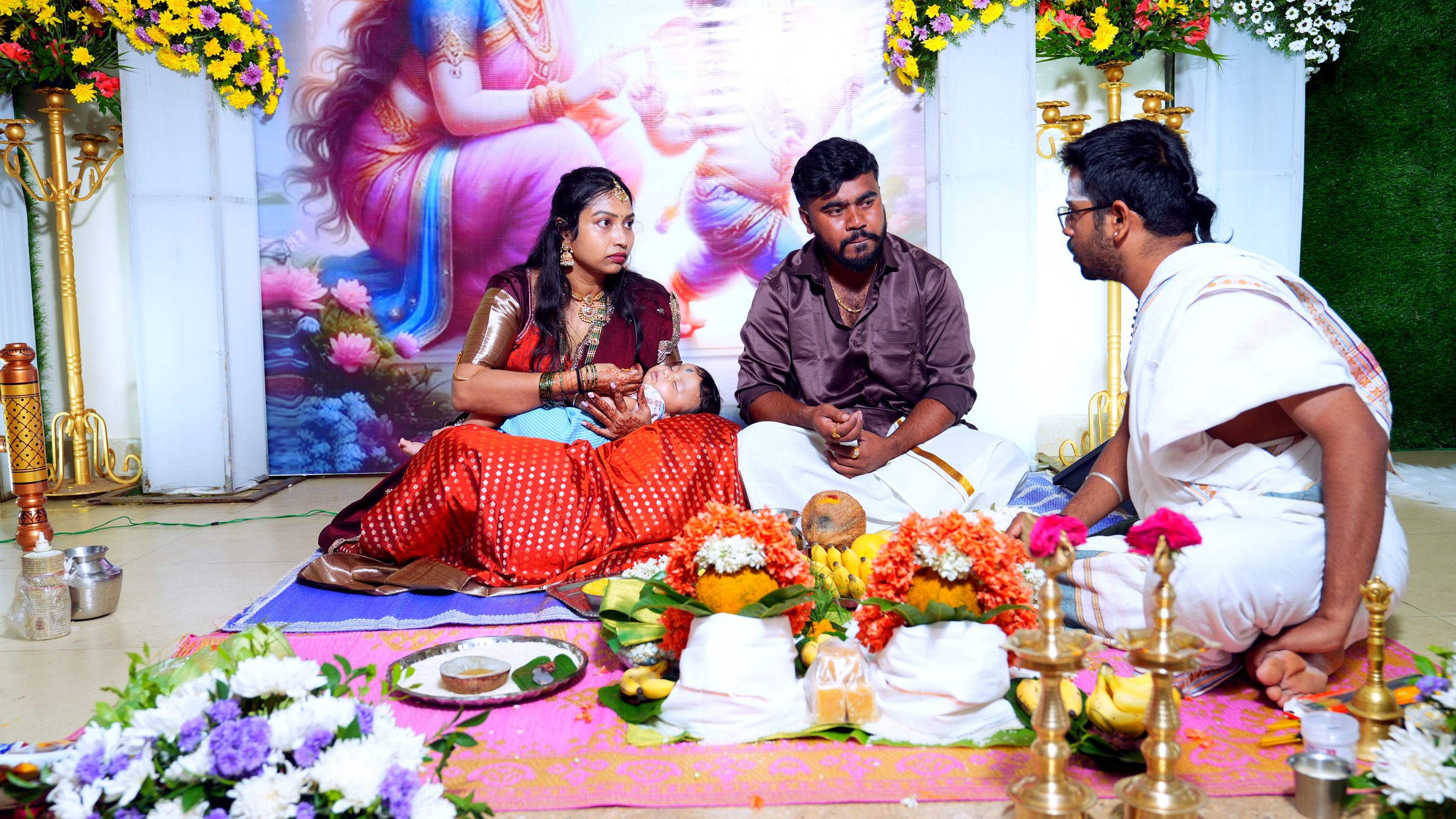 Priest performing the naming ceremony ritual