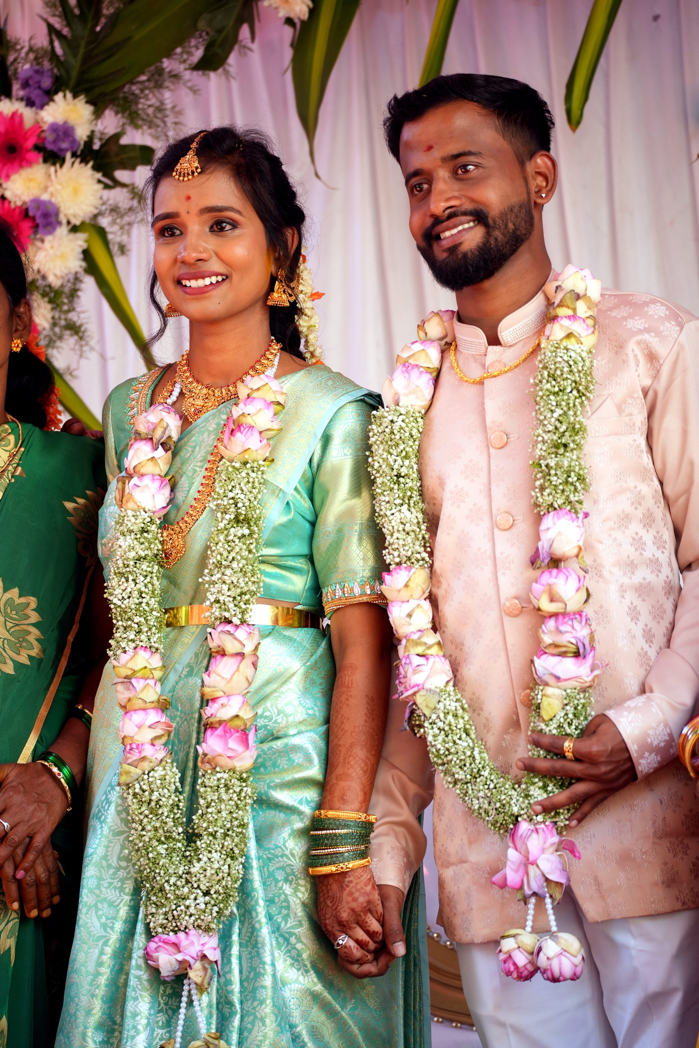 Couple during an outdoor pre-wedding shoot in a green setting, by Lumeora Studios